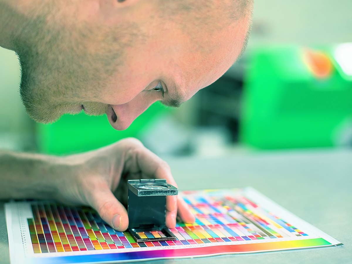 A man choosing a printing color carefully